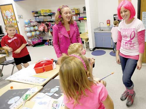 Photo by Tracy Klimek/New Jersey Herald - Green Hills School seventh-grader McKenzie Delahanty, left, talks to first-grade teacher Tara Lavalley, right, and her students as they all wear pink for Pink Out Day on Oct. 19.