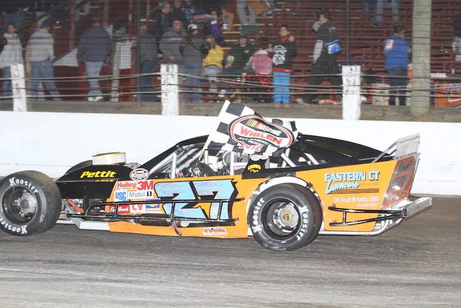 Tyler Chadwick celebrates his victory Saturday night at the Waterford Speedbowl. ()