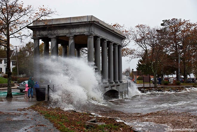A wave crashes over Plymouth Rock during Hurricane Sandy on Monday, Oct. 29, 2012.