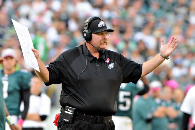 Eagles head coach Andy Reid questions a call during the team's 26-23 overtime loss to the Lions at the Linc.