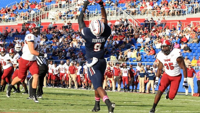 This is Florida Atlantic’s Nexon Dorvilus making one of his two td receptions Saturday versus Troy. The photo is courtesy of JC Ridley.