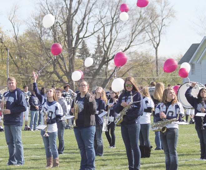 The Annawan High School Marching Band released maroon and white balloons following a moment of silence before Saturday’s Annawan-Wethersfield Titans playoff football game in memory of Roxanne Aper, AHS band director for the past 26 years, who died Wednesday.