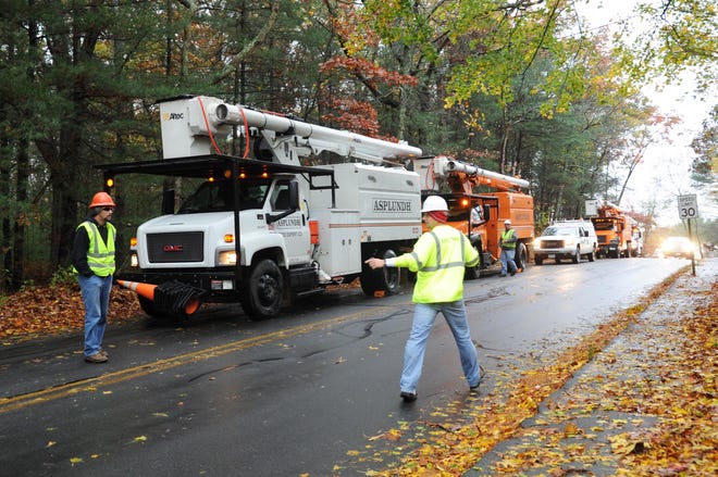 Tree crews line Vernon Street in Bridgewater, during Hurricane Sandy, on Monday, Oct. 29, 2012.(Marc Vasconcellos/The Enterprise)