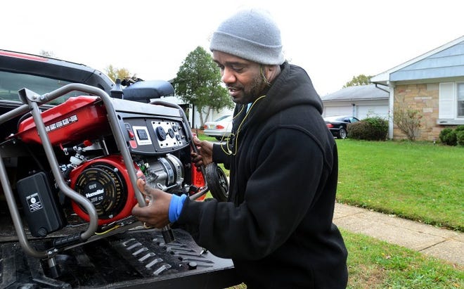 Richard Guinyard, a resident on Gardenbrook Lane in the Garfield section in Willingboro had borrowed a freind's generator since his fmaily has been without power since Hurricane Sandy hit the area late Monday night. Powere is supposed to be restored by Monday November 5th.