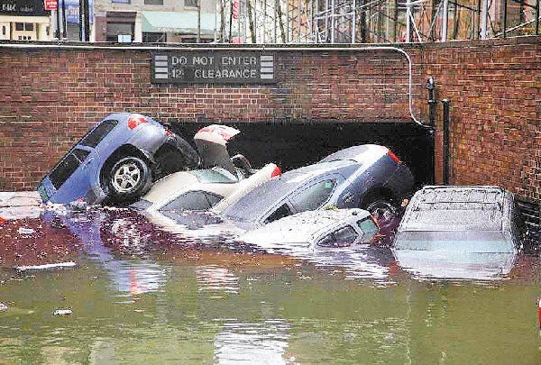 Cars are submerged at the entrance to a parking garage in New York's Financial District in the aftermath of superstorm Sandy on Tuesday.