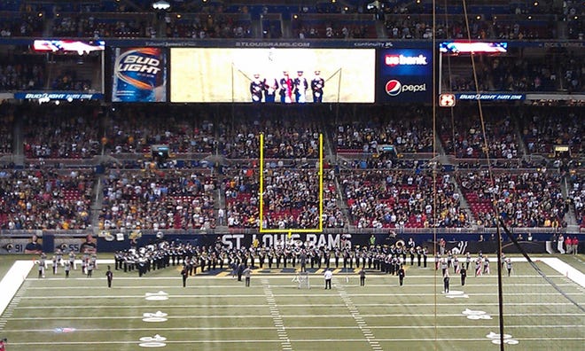 The IVC Marching Grey Ghosts play the national anthem for the crowd of more than 64,000 fans at the Edward Jones Dome in St. Louis before the St. Louis Rams and Green Bay Packers football game. The Packers won the game, 30-20. It was the first time the school has played at an NFL game.
