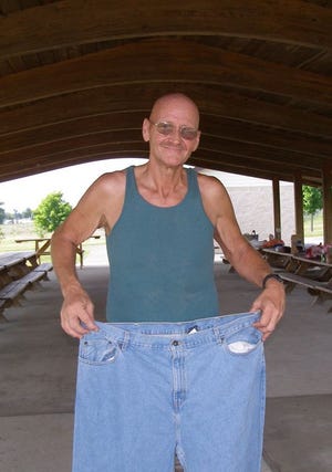 Larry Witmer's waist size went from 46 to 34 after his 100-pound weight loss. He recently visited Antrim Township Community Park to run five miles and then bike 15 miles.