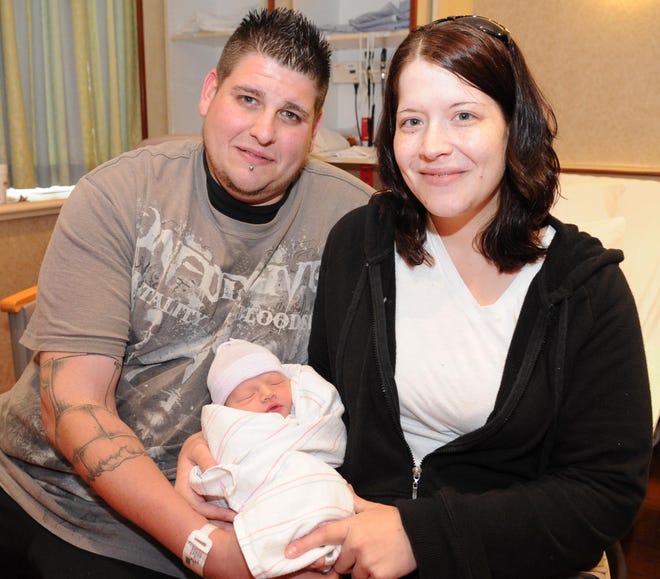 Eric Aguiar with his girlfriend Diane Holmes, both of Taunton, and their baby, Caleb Aguiar, who was born at Signature Healthcare Brockton Hospital during the storm.