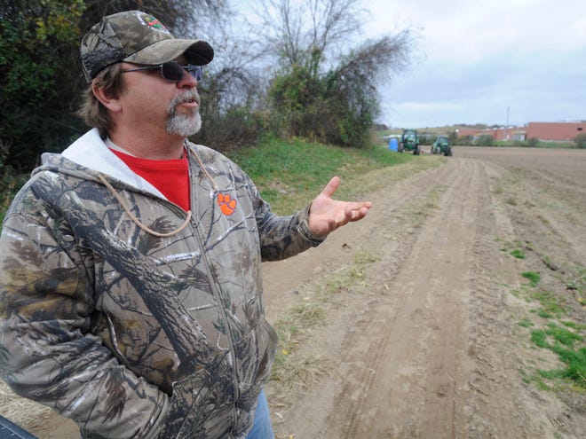Kirby Johnson talks about his farm land in Mills River Tuesday. Johnson is a member of Mills Rivers Partnership, which is working together to protect the Mills River watershed.