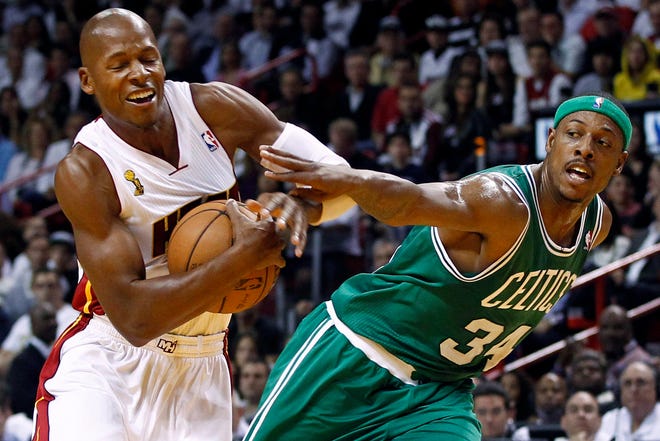 Boston Celtics' Paul Pierce (34) fouls Miami Heat's Ray Allen, left, during the first half of an NBA basketball game, Tuesday, Oct. 30, 2012, in Miami. ()