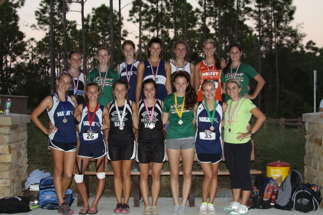 The 2012 girls all-county cross country team. Front row, left to right: Mikayla Hodges, Arnold; Michaela Ansley, Arnold; Melissa Garred, Rutherford; Jodi Phillips, Rutherford; Gabrielle Krajniak, Mosley; Christina Gaillard, Arnold; Ashtin Noyes, Mosley. Back row: Andrea Ceeley, North Bay Haven; Katie Kinard, Mosley; Cami Bazin, Arnold; McKenna Hyman, Arnold; Parauka Kalli, North Bay Haven; Regan Hamrick, Mosley; Brittany Blume-Bush, Mosley. Not pictured: Paxton Newell, Bay.