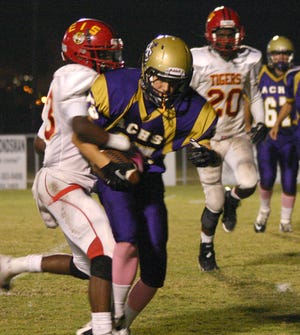 East Iberville's Lamont Kerr strips the football from Ascension Catholic's Garrett Hales as Tony Westly closes in during the fourth quarter of the Tigers' 55-20 District 9-1A loss on Thursday night. Kerr had three fumble recoveries returning one for a touchdown. 

POST SOUTH PHOTO/Peter Silas Pasqua