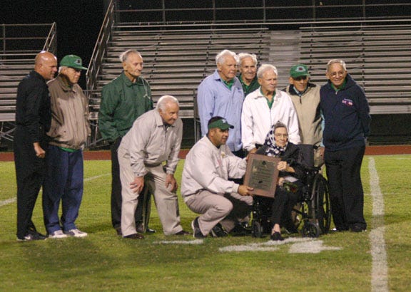 Former members of Plaquemine High School’s boxing teams were honored at halftime of the Green Devils’ football game with Belaire on Friday night. Attending in no particular order were coach T.E. Bickham, Don Gascon, Don Alberado, Dudley Nicolosi, Jack Franklin, Gerald Orney Hebert, Bobby Freeman, Wilson Banta, Merlin Banta, David Boudreaux, Leo Canova, Lillie Distefano, widow of Sam Distefano, and Plaquemine football coach Paul Distefano. 
POST SOUTH PHOTO/Peter Silas Pasqua