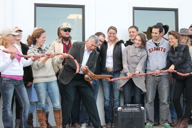 Yreka Mayor David Simmen did the honors of cutting the sausage ribbon at the grand opening of the Belcampo Meat Company butchery on Friday. The international meat company operates farms/ranches in Shasta Valley, Belize and Uruguay and the new butchery provides 30 new jobs to the are
