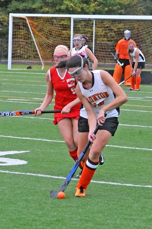 Taunton High’s Katelin Morrissey (10) controls the ball as New Bedford’s Ana Dearaujo trails the play during Tuesday’s non-league game at Taunton High school.