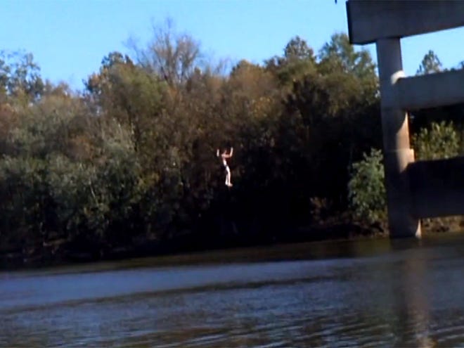 A man posted a Youtube video of himself jumping off of the toll bridge spanning the Black Warrior River in Tuscaloosa on Sunday, Oct. 28, 2012. Witnesses saw the jump on and called police, leading to an extensive search involving dive teams and helicopters. (Youtube)