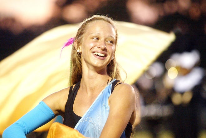 Havelock High color guard member Sasha Buslovich performs with the Havelock High marching band at a recent football game. Havelock High is hosting the Crystal Coast Band Classic today. The event features 22 high school bands from throughout the region.