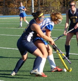 Littleton junior Stephanie Gentile challenges a Lunenburg opponent for the ball and later added a goal for the Tigers field hockey 2-0 league win on Monday, Oct. 22.