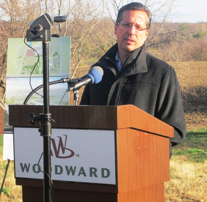 Woodward Inc. CEO Tom Gendron speaks during a ground-breaking ceremony for the company's new $200M aerospace manufacturing campus being built in Loves Park.