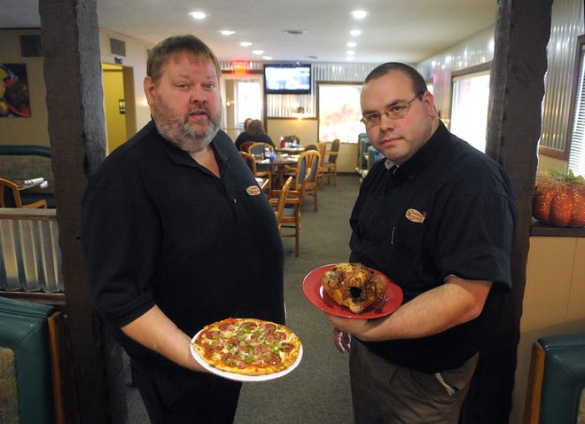 Tim VandenBosch, right, and Tim Stoike are the owners of a new restaurant in Holland, Timmy's Rotisserie. Dennis R.J. Geppert/Sentinel Staff