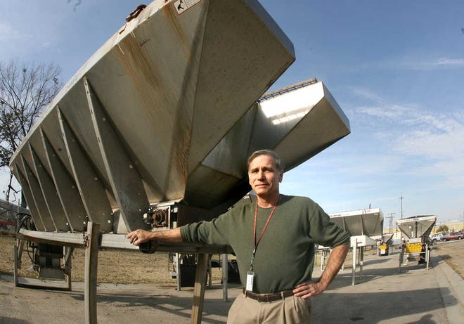 Ron Raines, city director of street maintenance and traffic operations, stands by several of the material spreaders that are staged at 201 N.W. Topeka for the upcoming winter weather. Raines said the city has on hand about 7,000 tons of a deicer named "Clearlane" that is produced by Cargill. He also said the city has about 3,500 gallons on hand of its corn-based liquid deicing product, with contracts being in place to allow the city to order any replacement materials that might be needed.