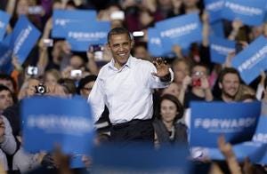 In this Nov. 3, 2012 file photo, President Obama waves as he is introduced at a campaign event in Milwaukee. (AP Photo/Morry Gash, File)