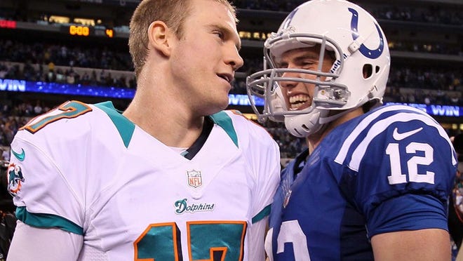Miami Dolphins quarterback Ryan Tannehill (17) talks with Indianapolis Colts quarterback Andrew Luck (12) after the Colts defeated the Dolphins 23-20 at Lucas Oil Stadium in Indianapolis, Indiana on November 4, 2012. (Allen Eyestone/The Palm Beach Post)