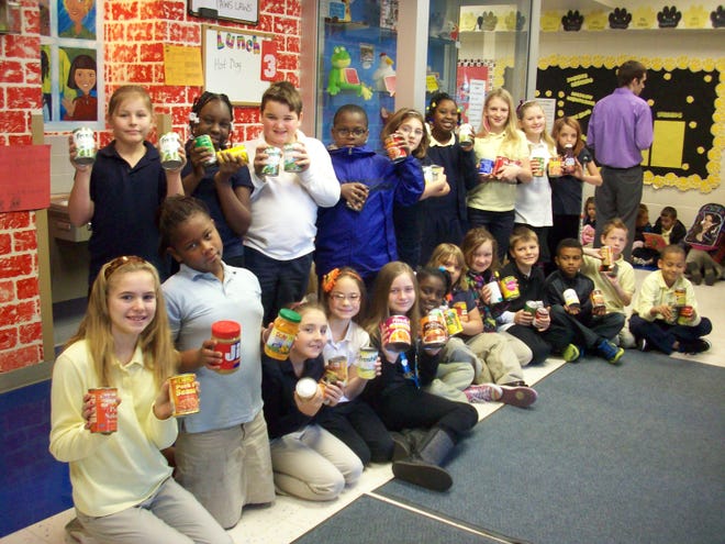 Pictured: 4th Grade Center School K-Kids with some of the donations that were collected.