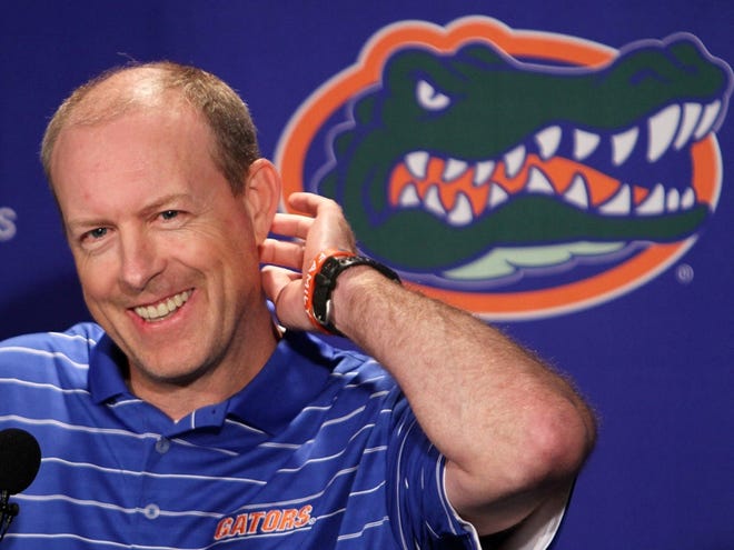 In this photo taken March 13, 2012m Florida offensive coordinator Brent Pease talks with media during an NCAA college football press conference in Gainesville, Fla. Pease is apologizing for using obscenities after being caught on camera obviously swearing during the Gators' season opener.