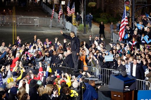 President Barack Obama waves to the supporters who stayed behind to the very end of the final 2012 campaign event in downtown Des Moines, Iowa, Tuesday, Nov. 6, 2012. (AP Photo/Pablo Martinez Monsivais)