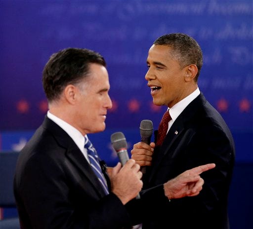 FILE - In this Oct. 18, 2012 file photo, President Barack Obama, right, and Republican presidential candidate, former Massachusetts Gov. Mitt Romney exchange views during the second presidential debate at Hofstra University in Hempstead, N.Y. The binders are long gone, but Mitt Romney's awkward phrase is likely to endure at least a little longer. The GOP nominee was trying to convey his commitment to hiring women when he spoke during one of the debates about demanding more potential job applicants when he was Massachusetts governor. (AP Photo/David Goldman, File)