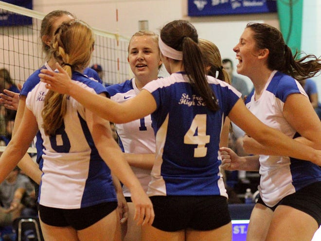 St. Francis players celebrate a hit against P.K. Yonge on Tuesday night.