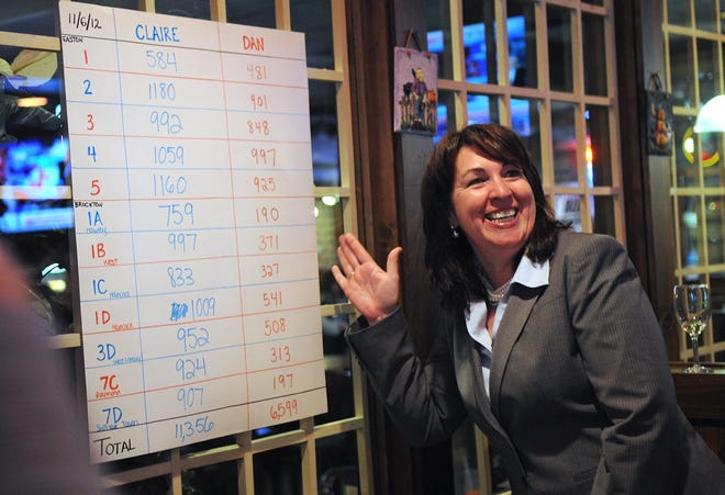 Claire Cronin smiles as she points to the unofficial vote tallies on a board in Owen O'Leary's in Brockton on Tuesday, November 6, 2012, as she wins the State Representative race for the 11th Plymouth district over Dan Murphy.
