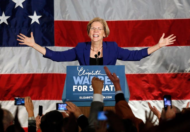 Democrat Elizabeth Warren takes the stage after defeating incumbent GOP Sen. Scott Brown in the Massachusetts Senate race, during an election night rally at the Fairmont Copley Plaza hotel in Boston, Tuesday, Nov. 6.