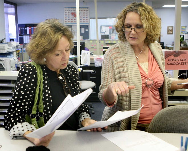 Rep. Ann Mah, D-Topeka, left, talks to Penny Prokop, Shawnee County Election Office's director of voter services, on Wednesday morning. Trailing by fewer than 30 votes with several hundred provisional ballots possibly still in play, Mah was at the office checking on provisional ballot numbers by polling place.