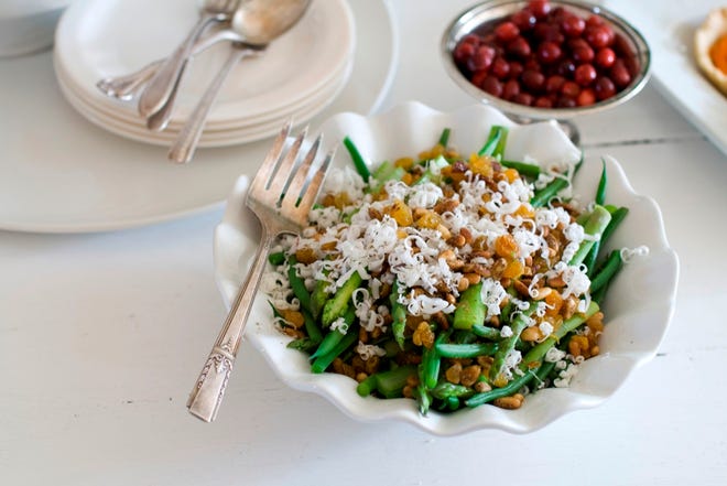 Asparagus and haricots verts with goat cheese and pine nuts. (The Associated Press)