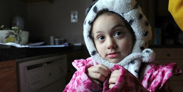With no choice but to bundle up against the cold, Alliyah Santiago, 4, Anthony Tumminia's granddaughter, wears her best winter clothes inside her house in Winona Lakes. It's been more than a week with power and heat after Hurricane Sandy knocked her family's power out last Monday. Alliyah lives with her grandfather, her mother and her uncle.
