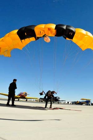 U.S. Army Sgt. Jonathan Lopez, a native of Dorado, Puerto Rico, and demonstration parachutist assigned to the U.S. Army Parachute Team, Golden Knights, lands on target during the 31st annual Amigo Airsho on Biggs Army Airfield, Texas, Oct. 21. The Golden Knights date back to 1959 when the Army put together a 13-person team to compete in the sport of skydiving. Since then, they have been performing throughout the country as a recruiting tool.