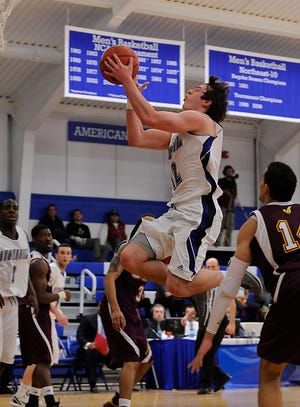 Stonehill College junior guard Brian Hamor drives to the basket against the University of the District of Columbia Saturday in the NCAA Div. 2 East Regional tourney at Worcester.