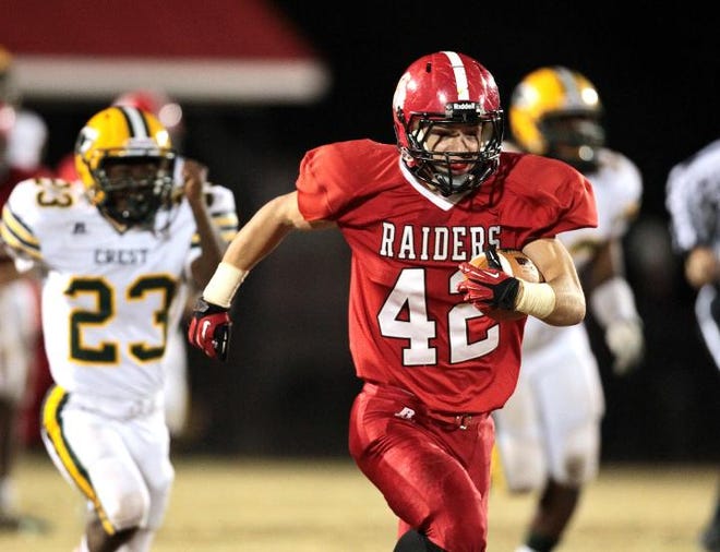 South Point running back Tyler Bray runs from a couple of Crest defenders on Friday in Belmont. Bray set a county-record 381 yards rushing and scored five touchdowns in a defeat of Big South rival Crest.
