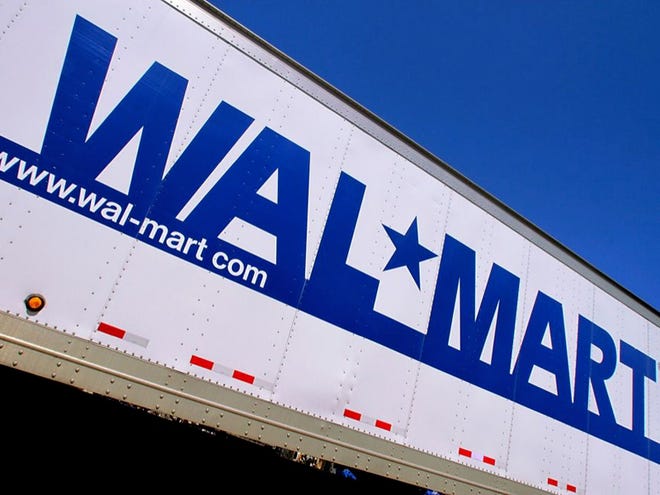 In this May 16, 2011 file photo, the Wal-Mart logo is displayed in Springfield, Ill. The world's largest retailer is throwing its doors open at 8 p.m. on Thanksgiving Day, two hours earlier than a year ago. It's also guaranteeing shoppers that it will have three of the most popular items it sells if they line up inside the store during a one-hour event that day.