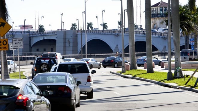 Cars back up on Flagler Drive in West Palm Beach Wednesday morning November 7, waiting to cross the Royal Park Bridge.