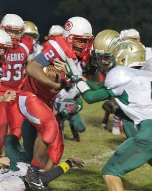 Florida School for the Deaf and the Blind's KJ McDade rushes the ball during Thursday's game against St. Joseph.