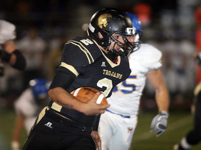 Topeka High's Raymond Solis (2) runs for his first touchdown the first half of the Hutchinson-Topeka High playoff Friday at Hummer Sports Park.