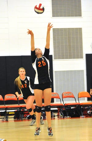 Newton North's Talya Feldman stretches for a hit during the Tigers' 3-2 girls volleyball victory over previously unbeaten Barnstable at North High on Wednesday.