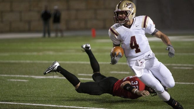 Rouse receiver Billy McCrary eludes a would-be tackler on a first-quarter play against Vista Ridge. The Raiders won 35-10 and qualified for the Class 4A playoffs.