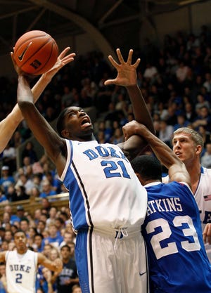 Associated Press Duke’s Amile Jefferson tries to shoot as Georgia State’s Manny Atkins defends during their game in Durham on Friday.
