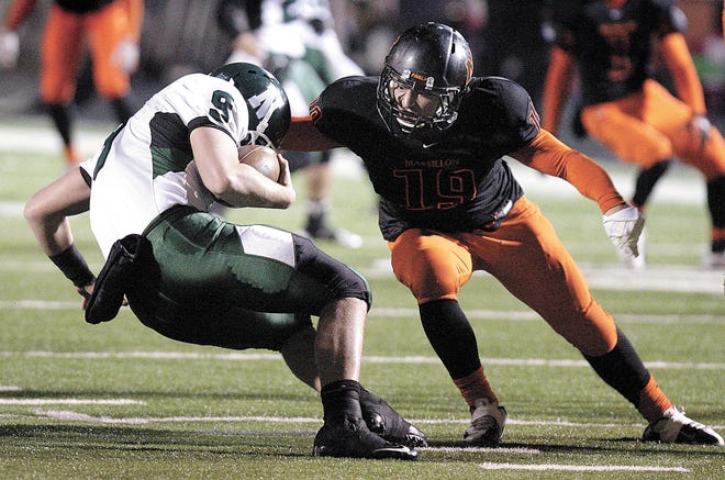 Massillon’s J.D. Crabtree tackles Nordonia’s quarterback Tyler Alders during last week’s game. Crabtree, one of several sophomores who play key roles for the Tigers, leads the team in tackles for loss (11) and sacks (four).