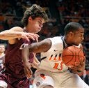 Colgate's Luke Roh (4) puts pressure on Illinois' Tracy Abrams in the first half of an NCAA college basketball game at Assembly Hall in Champaign, Ill., on Friday, Nov. 9, 2012.