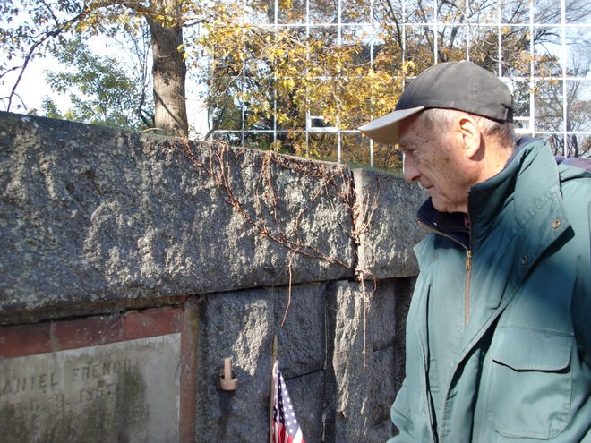 Joseph McDaniel follows the tour of Civil War graves at Hancock Cemetery with Ed Fitzgerald.